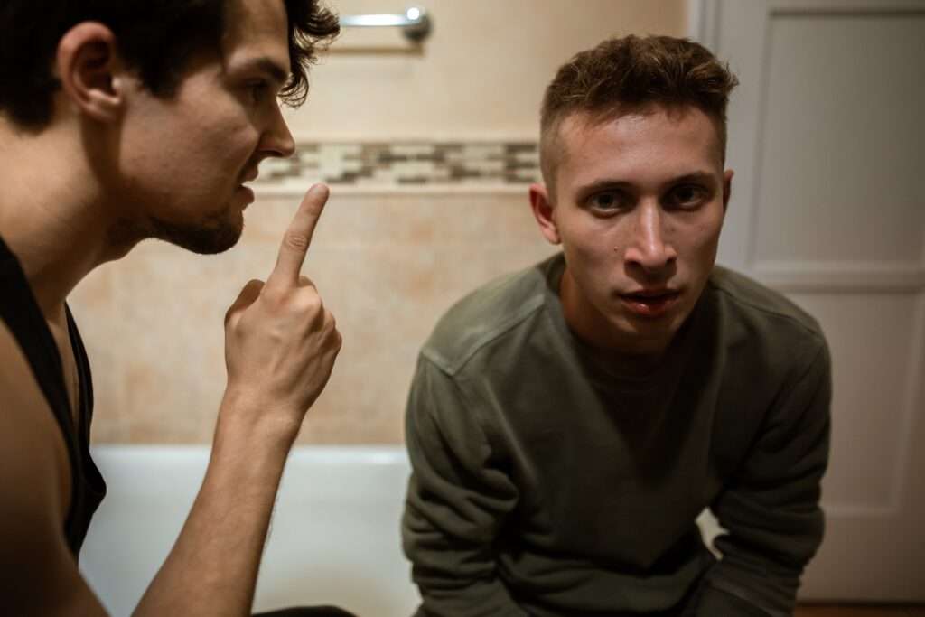 A man pointing a finger at his reflection in a mirror, symbolizing the double standard of self-criticism versus self-perception. The Narcissist Will Go Insane If You Do THIS
